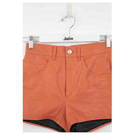 Saint Laurent-minishorts de cuero con talle alto-Naranja