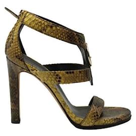 Gucci-Dunkelgelbe Gucci-Sandalen mit hohem Absatz und Schlangenmuster-Gelb