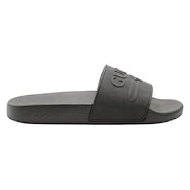 Gucci-Slides de borracha com logotipo preto em relevo-Preto