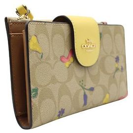 Portafoglio per telefono Coach beige e giallo con stampa floreale e vegetale Beige