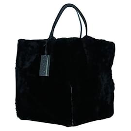 Autre Marque-ZEITGENÖSSISCHE DESIGNER-Tasche aus schwarzem Fell mit Besatz aus Lammleder-Schwarz