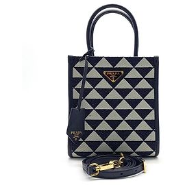 Mini borsa tote e tracolla Prada Symbol in jacquard (1BA355) Crudo Blu navy