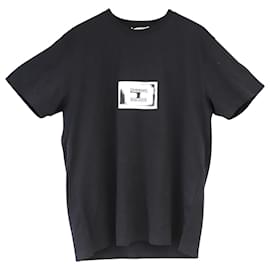 Givenchy-T-shirt con logo stampato di Givenchy in jersey di cotone nero-Nero