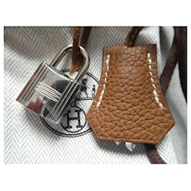 Hermès-chave, puxador e cadeado Hermès novos para bolsa Hermès, caixa e saco de pó.-Marrom