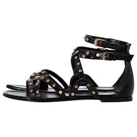 Saint Laurent-Sandalias planas con tiras y tachuelas de Saint Laurent en cuero negro-Negro