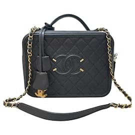 Chanel-Estuche de tocador de filigrana de Chanel, bolso acolchado de caviar en tono dorado.-Negro