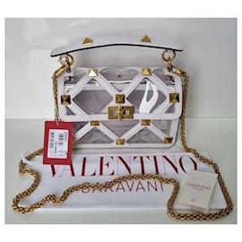 Valentino Garavani-Bolso de mano Valentino Garavani Roman Stud mediano en rosa pastel de material polimérico y piel blanca.-Blanco