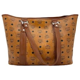 MCM-Bolso de compras MCM, bolso bandolera, bolso color coñac marrón con estampado de logo, bolso de mano.-Coñac