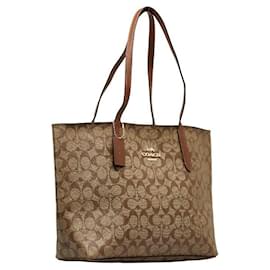 Coach-Sac fourre-tout en PVC cuir Coach Signature F67108 en très bon état-Marron