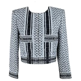 Chanel-Chaqueta de tweed estilo icónico de Gigi Hadid por 9,000 dólares.-Negro