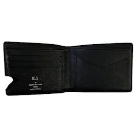 Louis Vuitton-Louis Vuitton Taiga Multiple Wallet Leather Short Wallet M30531 in excellent condition-Other
