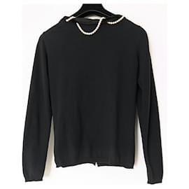 Moschino Cheap And Chic-Moschino Cheap and Chic black cardigan adorned with a white pearl necklace-Black