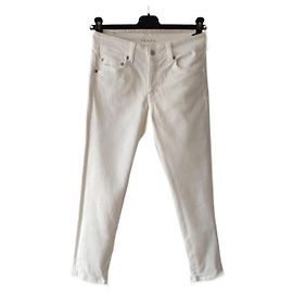 PANTALONES VAQUEROS PRADA EN DENIM ELÁSTICO. Blanco