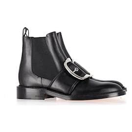 Botins com fivela Givenchy em couro preto Preto