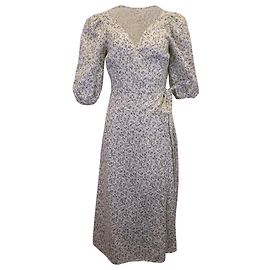 Vestido midi cruzado en lino verde menta de Reformation Verde