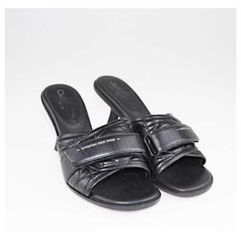 Christian Dior-Sandali slide con tacco Evolution in pelle nera Cannage Dior-Nero