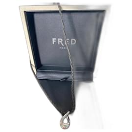 Fred-Autentico pendente movimentato con diamante e nastro passamaneria nero e oro grigio della Maison Fred.-Argento