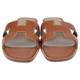 Hermès-Chanclas planas Hermes Gold Oran-Dorado