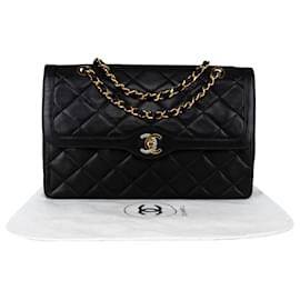 Chanel-Sac à rabat moyen doublé bicolore en cuir d'agneau matelassé en or 24 carats Chanel-Noir