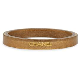 Chanel-Pulseira Chanel com logotipo de resina brilhante dourada-Dourado