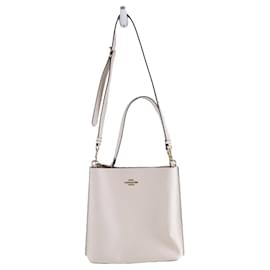 Coach-Este bolso bandolera presenta un cuerpo de cuero.-Beige