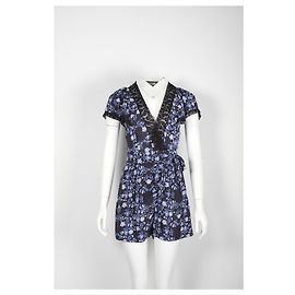 Sandro Blauer Strampler mit Blumenmuster und Spitzenbesatz Blau