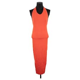 fenty orange dress Rihanna Looks So Badass Sitting on a Swing Ride in This Strapless Orange Dress