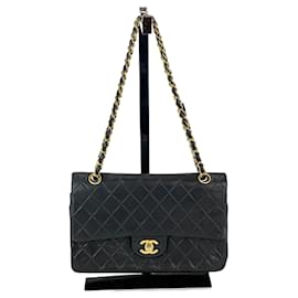 Chanel-Sac à bandoulière noir à rabat doublé moyen en cuir d'agneau matelassé Chanel-Noir