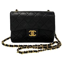 Chanel-Sac à bandoulière en cuir Chanel Mini Classic Single Flap en très bon état-Noir