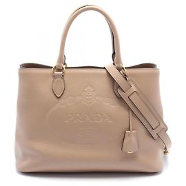 Sac à main en cuir avec logo Prada embossé 1BA579 en excellent état Rose