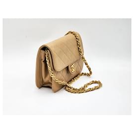 Chanel-Bolsa mini flap clássica atemporal Chanel-Bege