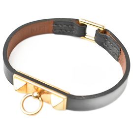 Hermès Bracciale rigido nero e oro Hermes Micro Rival Nero