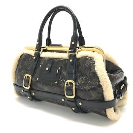 Bolsa de viagem Monogram em shearling Louis Vuitton Marrom
