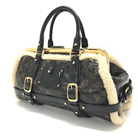 Louis Vuitton-Bolsa de viagem Monogram em shearling Louis Vuitton-Marrom