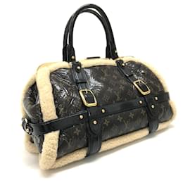 Louis Vuitton-Borsa da viaggio Monogram in shearling Louis Vuitton-Marrone