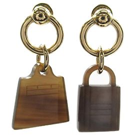 Hermès Boucles d'oreilles Kelly Cadena Maroquinier Hermes Amulette Marron Doré