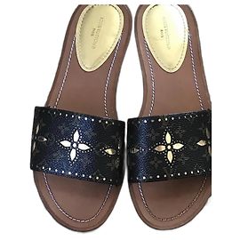 Louis Vuitton Mules planas Lock It Marrom Dourado