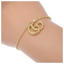 Pulseira charm Double G Gucci GG Marmont Dourado