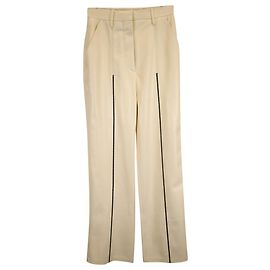 Calça reta Lucee da Nanushka em couro vegano creme Branco Cru