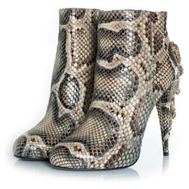 Botas de plataforma em couro de python Roberto Cavalli Outro