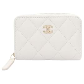 Chanel-Portafoglio con zip classico Chanel in pelle caviar bianca-Bianco