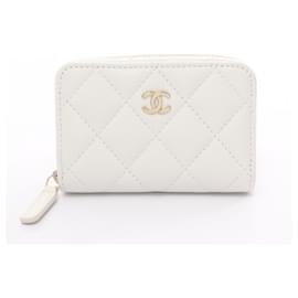 Chanel-Portafoglio con zip classico Chanel in pelle caviar bianca-Bianco