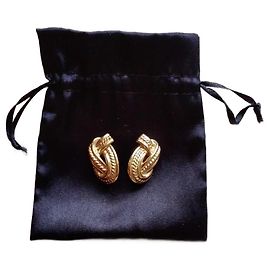 Boucles d'oreilles Yves Saint Laurent dorées en métal Doré
