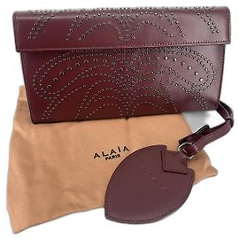 Alaïa Studded clutch Beige Dark red Silver hardware