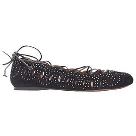 Alaïa Ballerine Alaia in suede nero con borchie argentate a forma di cerchio ritagliato e lacciate Nero