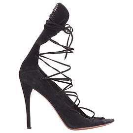 Alaïa Sandali con tacco strappy in pelle scamosciata nera Alaia con lacci e zip sul retro Nero