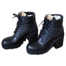 BOTAS GUCCI DE CUERO Y LONA. Negro