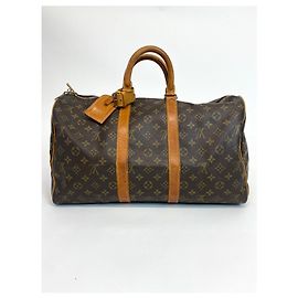 Louis Vuitton Keepall 45 Dourado
