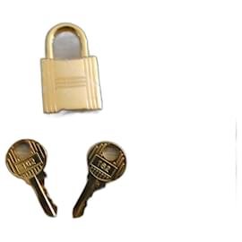Hermès neuer goldfarbener Vorhängeschloss mit 2 Schlüsseln für Birkin und Kelly. Gold hardware