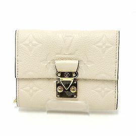 Cartera Metis Compact Crème Monogram Empreinte de tres pliegues Louis Vuitton Crudo